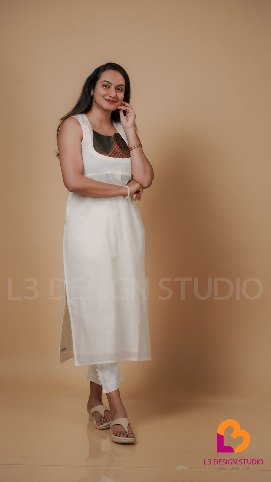 Off White Cotton Sleeveless Kurti with Golden and Dark Green Brocade Yoke