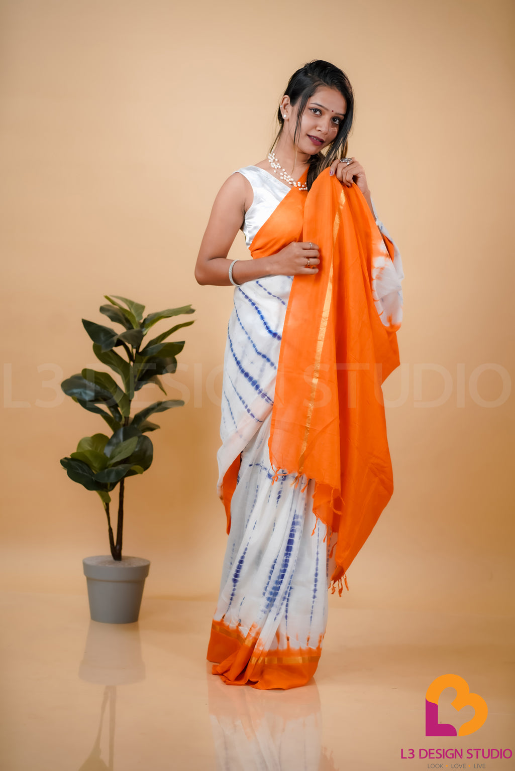 Off-White Assam Silk Saree with Indigo Blue Tie-Dye Pattern and Golden Zari Accents